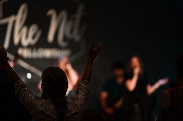 We lift our hands in worship of King Jesus!