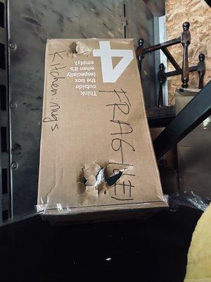 One of the clearly-labeled "FRAGILE!" boxes that was placed by the movers at the bottom of a huge stack of boxes, resulting in damages.