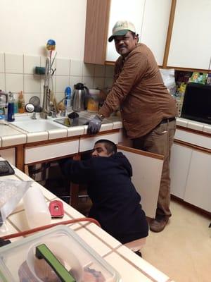 Nasir and Uncle Neal are installing a Giagni Kitchen Faucet in my kitchen:  Thank you so much!!