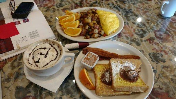 French toast with Cinnamon butter & Bacon. Mocha and the cheese omellette with deliciously fried potatoes and orange wedges. Fake syrup