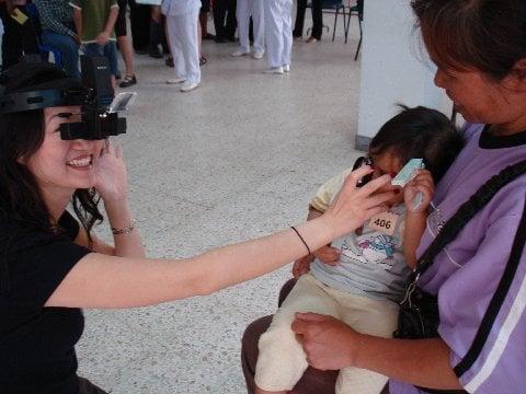 Dr. Chan screening patients off site.