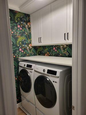 Laundry cabinets an countertop.