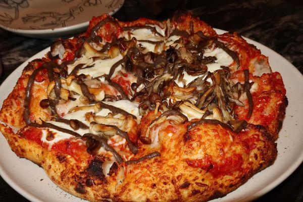 The Funghi Sourdough Pizza was made with black trumpets, hen of the woods, & black truffle puree.