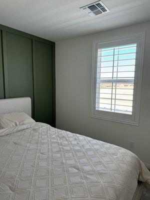 Shutters in guest bedroom.