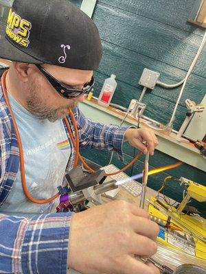 VapeHub owner Justin S. blowing glass in studio. Justin works retail at our shop Monday-Friday