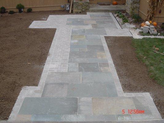 Bluestone walkway with paver edges.