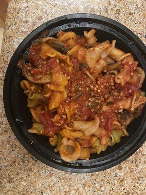 Rainbow pasta with mushrooms, arrabbiata sauce and truffle oil