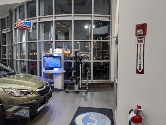 Entrance to dealership with tv