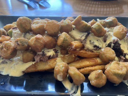 Loaded Option: hand cut fries, brisket, fried okra, and a savory melted cheese sauce!