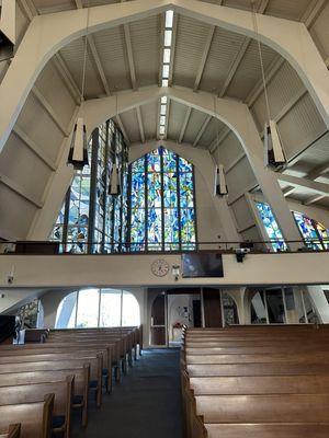 The stained glass in the back of the sanctuary