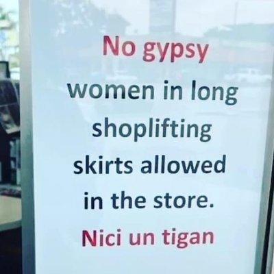 Photo of a racist sign posted in store window