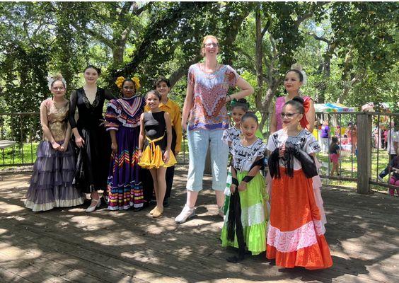 Students with Morgan Hartman during a Fiesta  fundraiser dance performance.