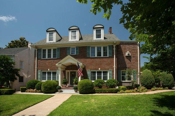 A classic home enhanced with Thermal Single Hung and Double Hung windows, along with a Therma-Tru door, sidelites and Larson storm door