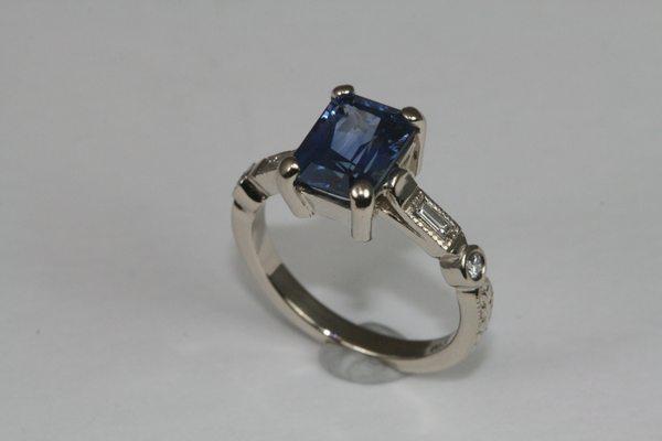 Ceylon sapphire engagement ring with diamonds and art deco detailing by Derek Simpson