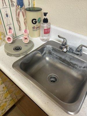 The sink the doctor never used during my appointment or probably ever by the looks of it.