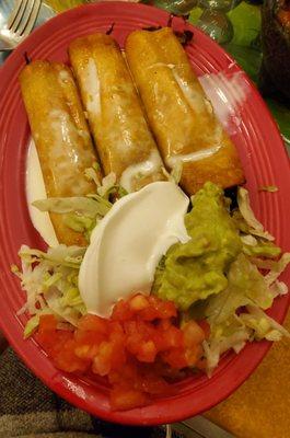 3 chicken flautas with shredded lettuce,  tomatoes, sour cream and guacomle $10.99.