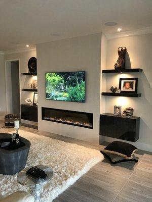 Build in fireplace with free standing cabinets and custom shelfs by AFK !