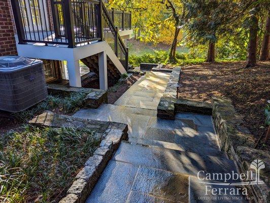 Flagstone Walkway with Natural Stone Retaining Wall and Deck Steps