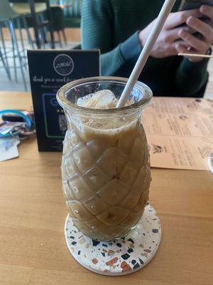 Iced coffee with oat milk and hazelnut