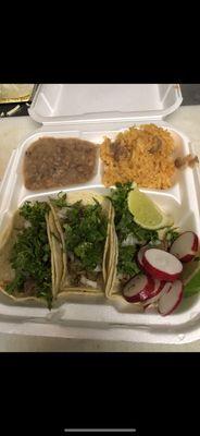 3 asada taco plate with rice and beans .