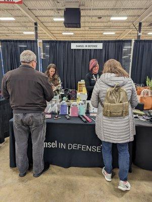 I liked this booth, very busy! Self defense items for women. Got their card.