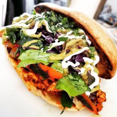 Chicken torta with their signature sauces and sauteed veggies