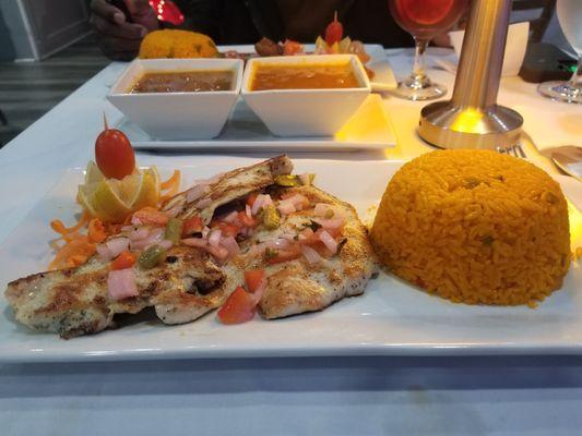 Grilled chicken breast with yellow rice and beans