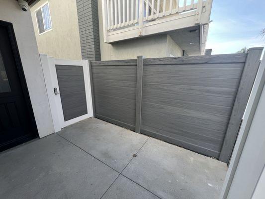 Custom horizontal gray vinyl fence