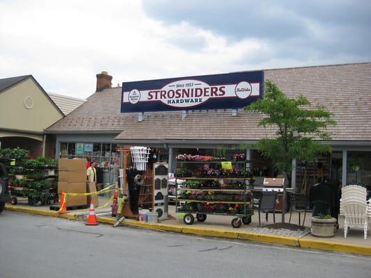 the storefront (with construction underway on the front sidewalk)