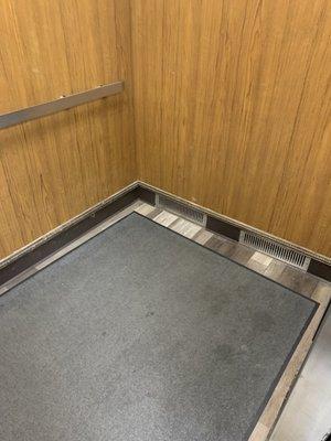 This is the Elevator the carpet is stained and dirty.