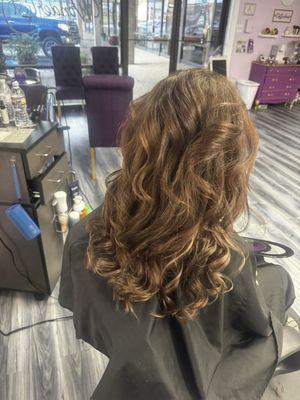 Beautiful client received warm tones with light caramel highlights