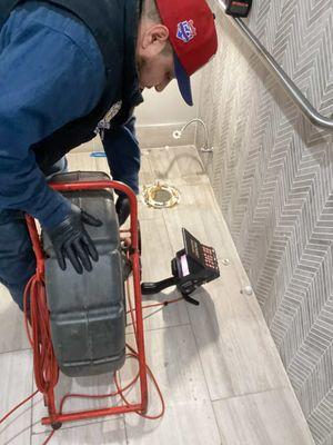 Sewer camera inspection in commercial bathroom