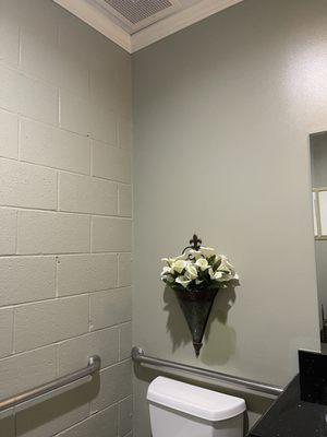 TOTAL HEALTH Bathroom has support rails... wise, proactive and considerate choice.  Its also has a nice touch of flowers