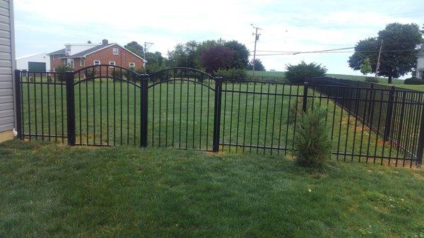 Aluminum black Richland.  We got a curved gate that really adds a touch of class.  lawn mower can get in.