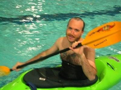 learning kayaking at an indoor pool