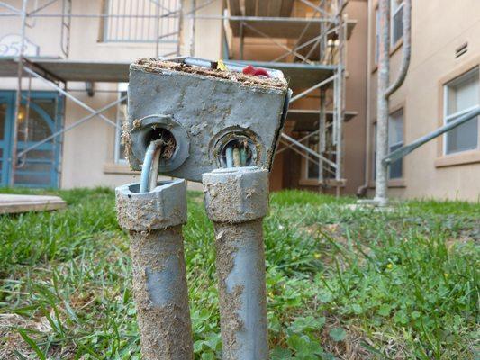 Damaged electrical conduit and wiring.