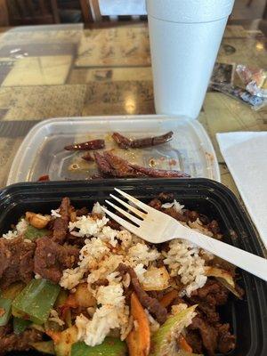 Beef in Dry Pot but served in plastic even though eating in restaurant.