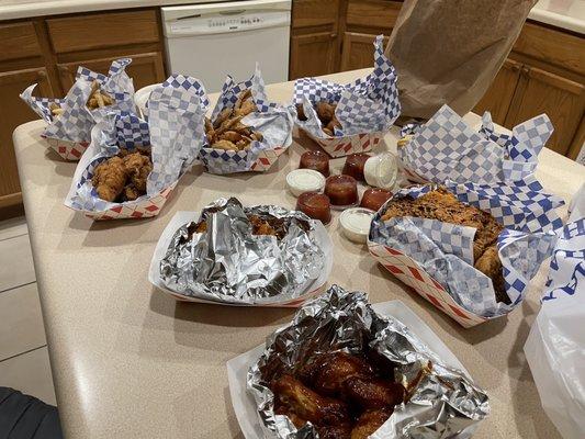 Shrimp, hot wings, fish fillets, chicken strips, fries, & hush puppies