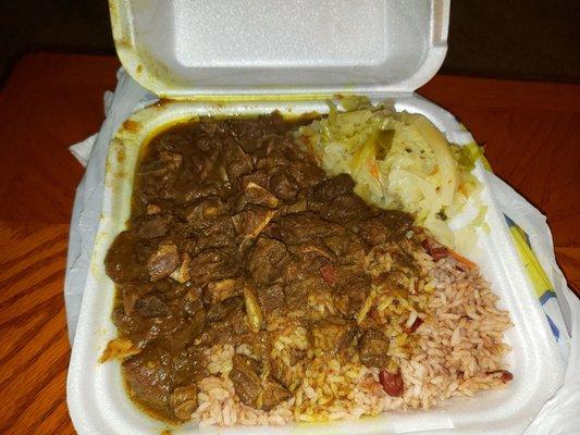 Large Curry goat with cabbage rice & beans