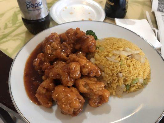 Honey chicken with fried rice and crumbs from a quickly eaten crab Rangoon