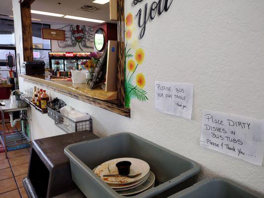 you pick up your food at the counter, and bus your own trays