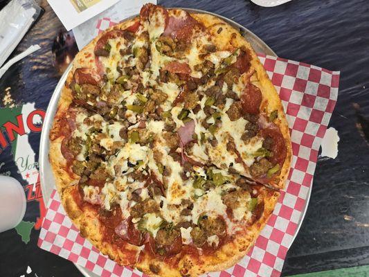 12" Italian stallion pizza. Beef ,sausage, pepperoni, Canadian bacon, and green chili