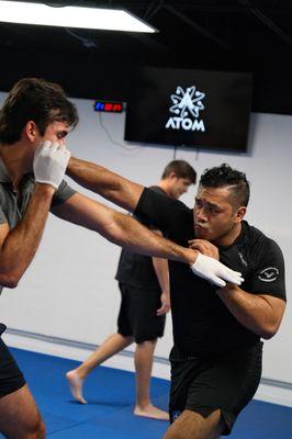 Our Partnership with ATOM includes jiu jitsu, kickboxing, and self defense! Saturdays we have open mat at 10am!