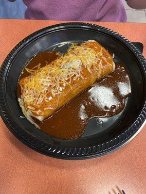 Ground beef burrito smothered with enchilada sauce