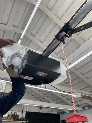 Eric from G&G garage door co. Installing new genie silent max garage door opener