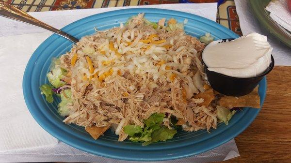 Taco salad. Doesnt come in a shell... sucks because that is the whole reason I ordered it :( sour cream is a side. $2