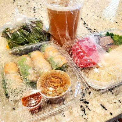 Spring rolls and pho (raw beef and brisket).