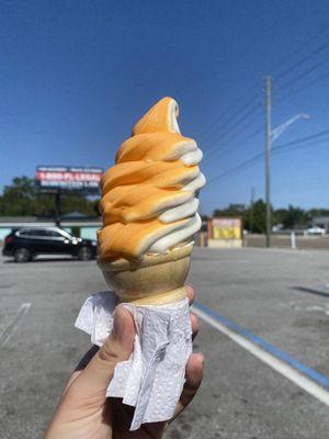 Orange vanilla swirl in a cone