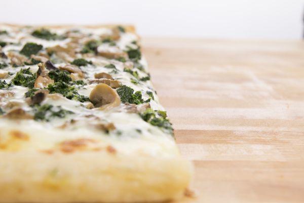 Spinach Specialty pizza - garlic oil, parmesan, spinach, mushrooms and mozzarella.  Delish!