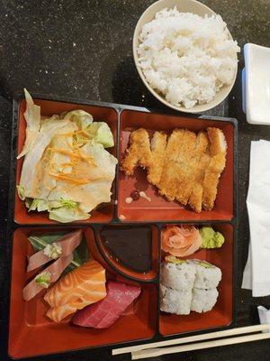 Combination box with chicken katsu, California roll, and sashimi